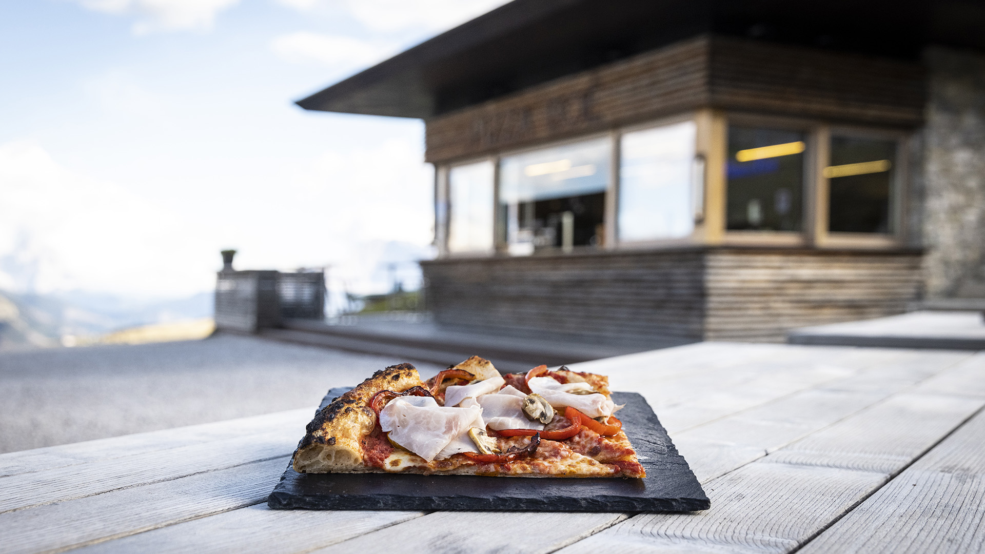 A tasty serving of three pizzas ready to be served in the self-service area.